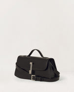 Kassandre Colonne clutch in black cow leather with silver hardware, rigorous lines, adjustable removable strap,crossbody bag, three quarter view