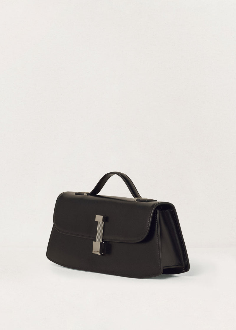 Kassandre Colonne clutch in black cow leather with silver hardware, rigorous lines, three quarter view