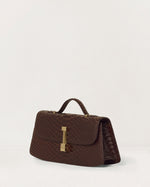Kassandre Colonne clutch in brown python-effect leather with gold hardware, three quarter view