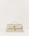 Kassandre Colonne clutch in off-white cow leather with gold hardware, rigorous lines, front view