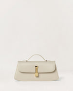 Kassandre Colonne clutch in off-white cow leather with gold hardware, rigorous lines, front view