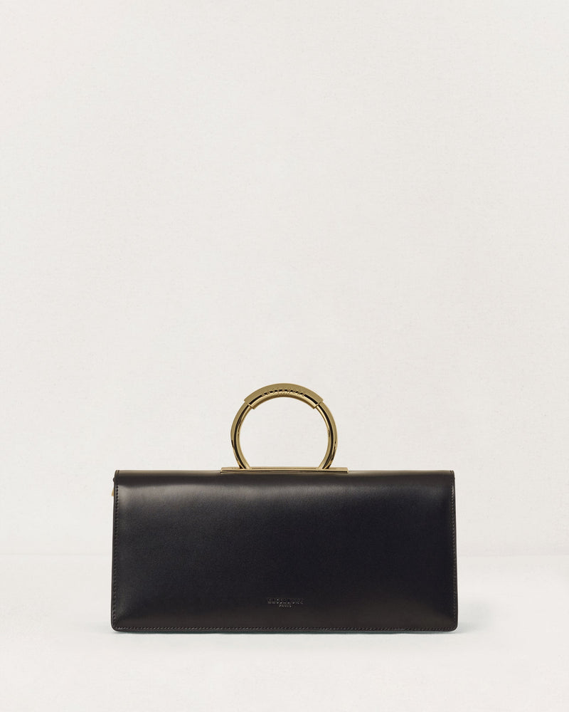 Kassandre Deva clutch in black cow leather with gold hardware, Art Deco geometry, removable strap , crossbody bag , front view