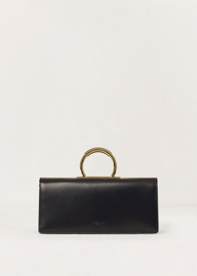 Kassandre Deva clutch in black cow leather with gold hardware, Art Deco geometry, removable strap , crossbody bag , front view