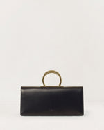 Kassandre Deva clutch in black cow leather with gold hardware, Art Deco geometry, removable strap , crossbody bag , front view
