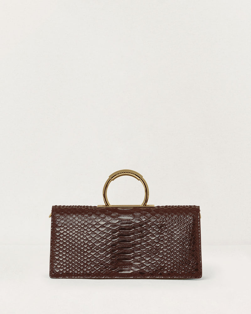 Kassandre Deva clutch in brown python-effect leather, sculptural Art Deco geometry, removable strap , crossbody bag ,front view