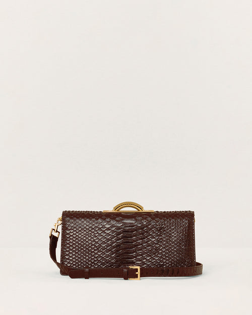 Kassandre Deva clutch in brown python-effect leather, sculptural Art Deco geometry, removable strap , crossbody bag ,front view