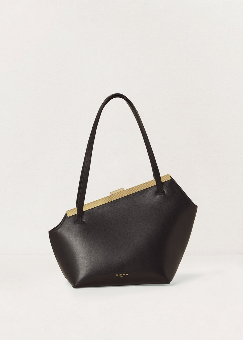 Kassandre Eileen asymmetric shoulder bag in black cow leather, architectural line, front view
