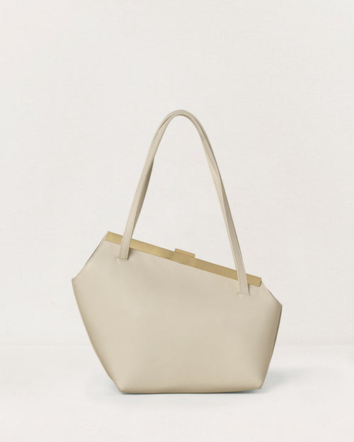 Kassandre Eileen asymmetric shoulder bag in off-white cow leather, clean line, gold frame, back view