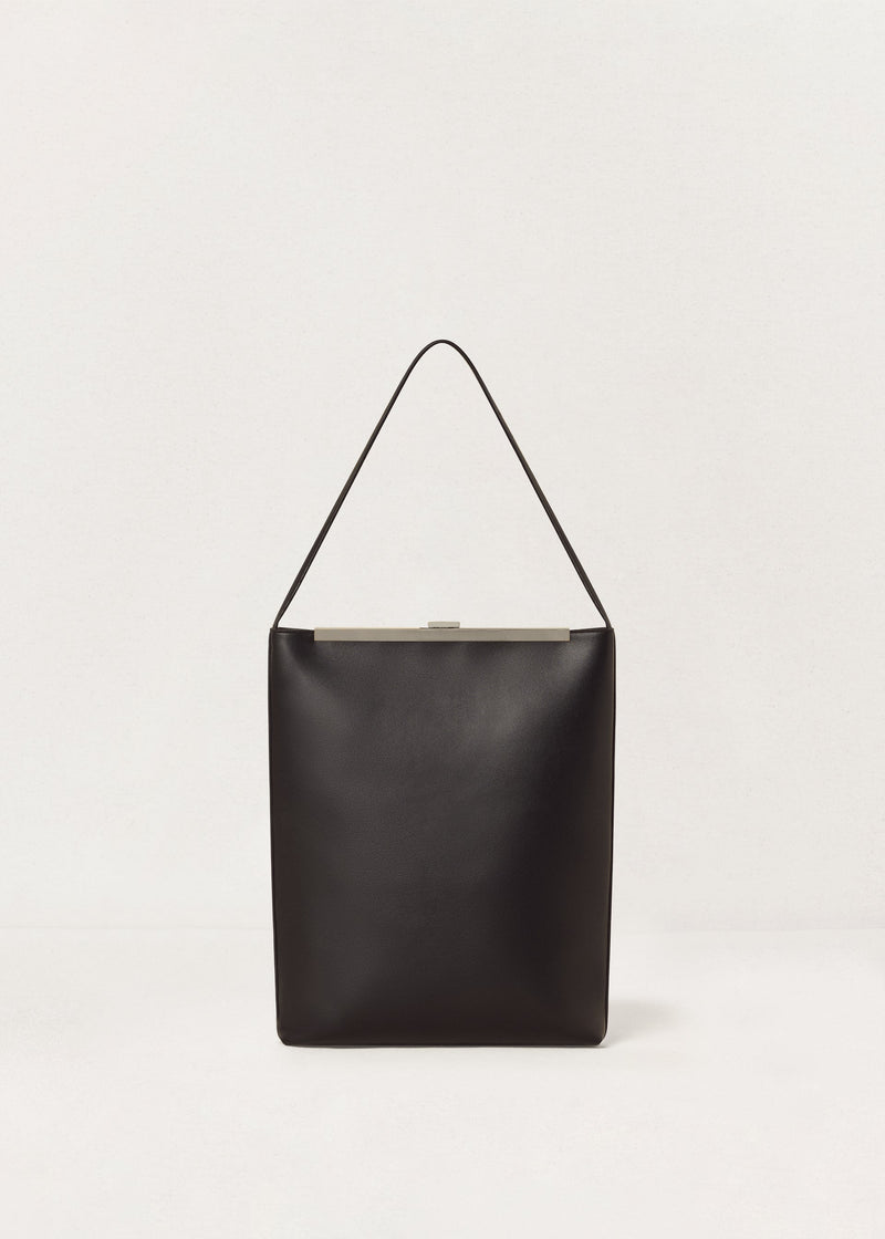 Kassandre Eileen computer bag in black cow leather with silver striped metal frame, back view