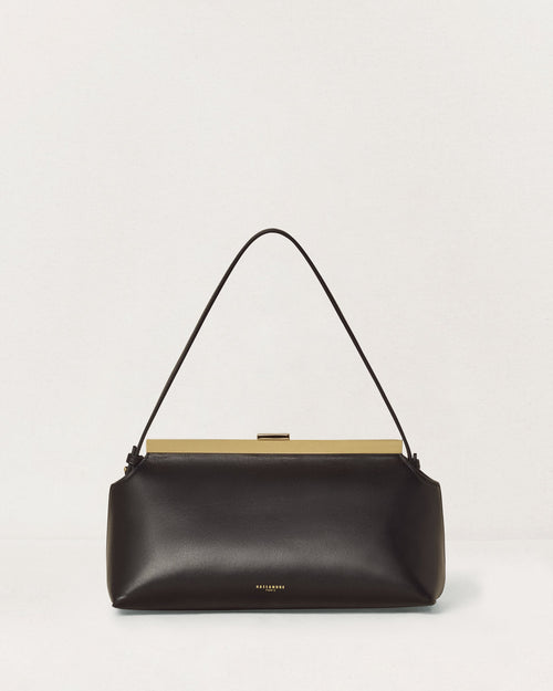 Kassandre Eileen shoulder bag in black smooth cow leather with striped metal frame, front view