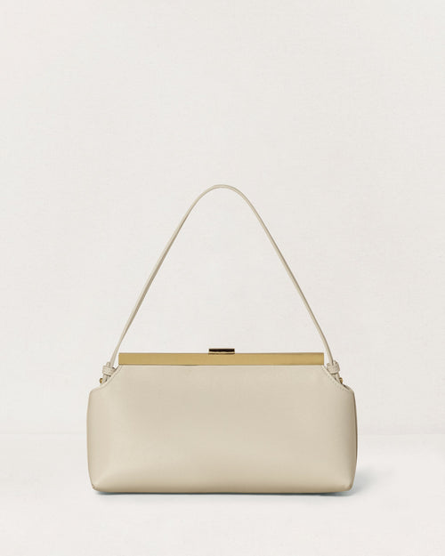 Kassandre Eileen shoulder bag in off-white cow leather with gold striped metal frame, back view
