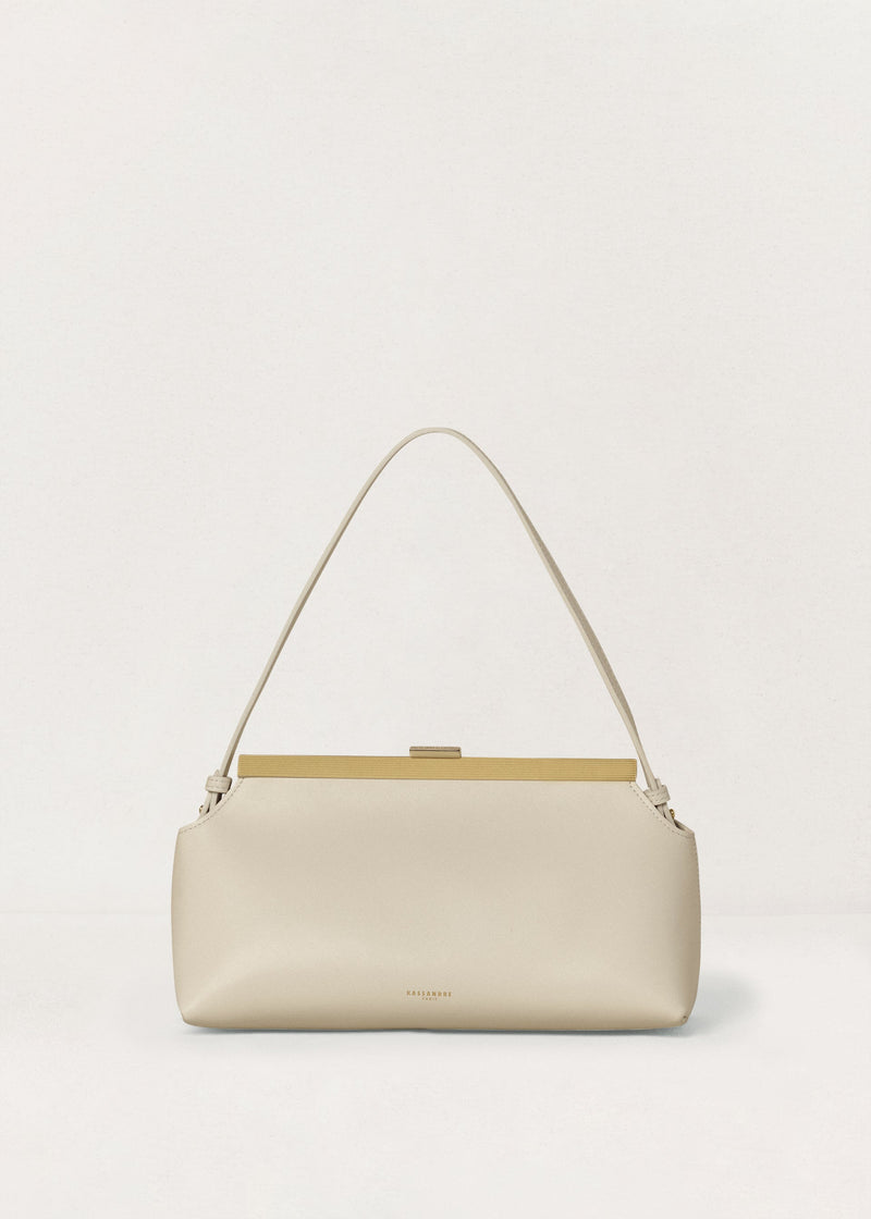 Kassandre Eileen shoulder bag in off-white cow leather with gold striped metal frame, front view