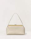 Kassandre Eileen shoulder bag in off-white cow leather with gold striped metal frame, front view